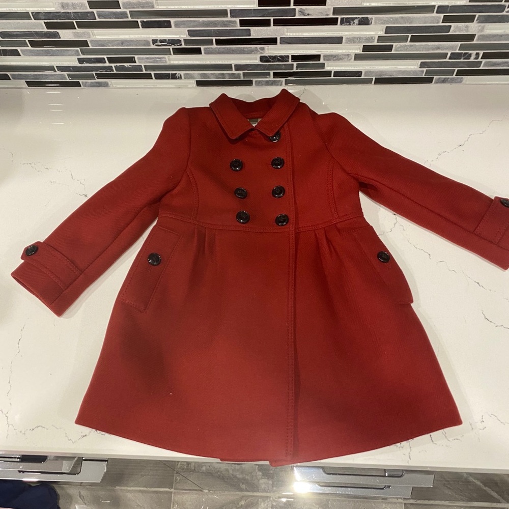 Never worn.  Super cute Burberry coat